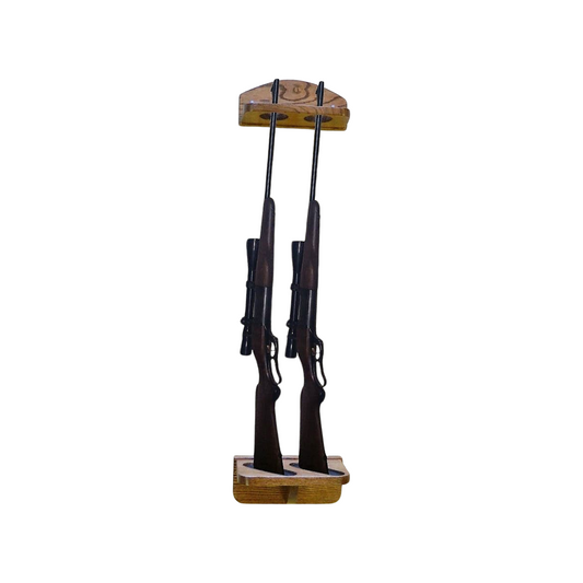 Wall-mounted solid oak gun rack with multiple slots, displaying a row of firearms in a single direction.